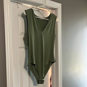 NWOT V neck bodysuit tank. Super soft 96%polyester 4%spandex. Great condition.